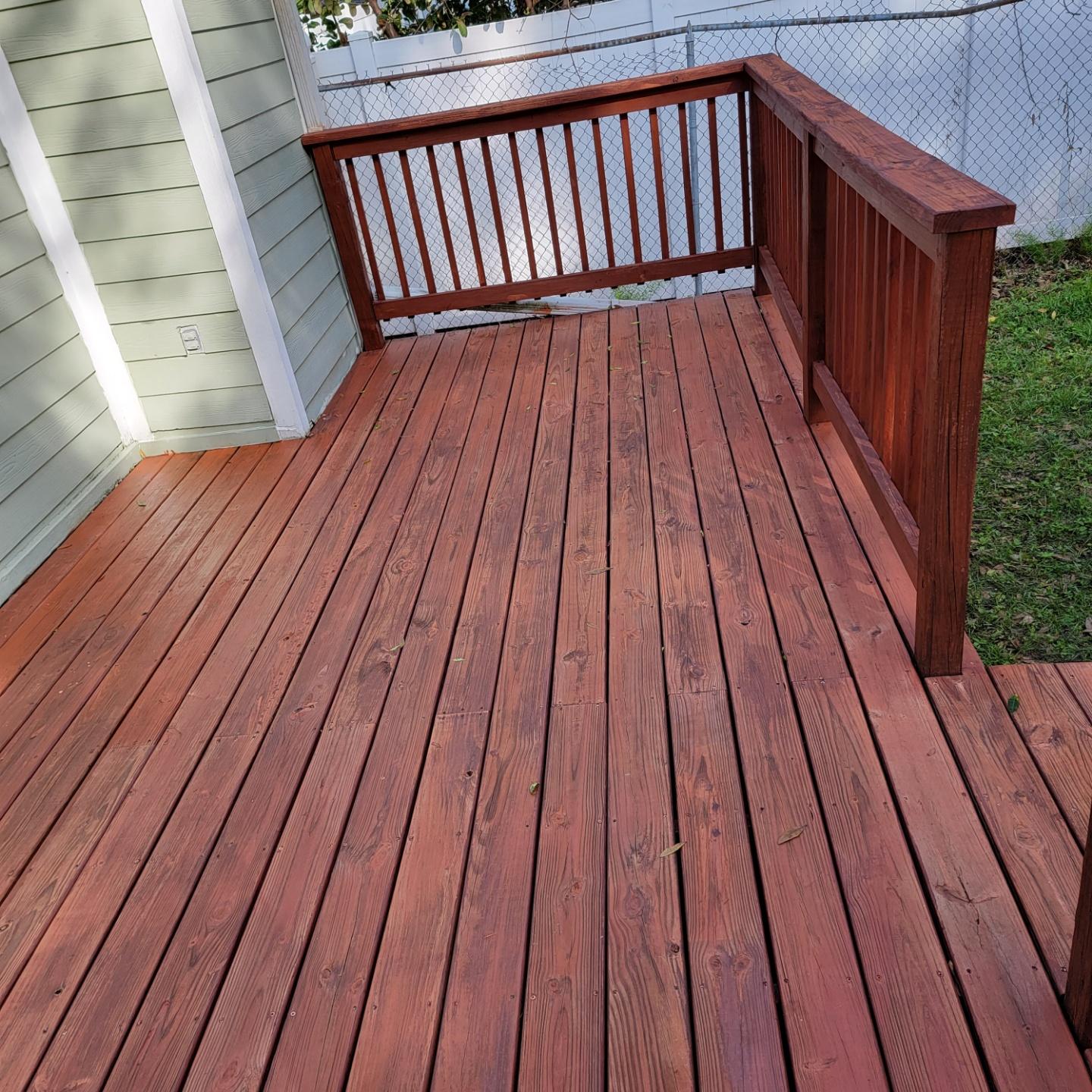 Pressure-treated wood deck after staining and refresh by Jack O' Trades