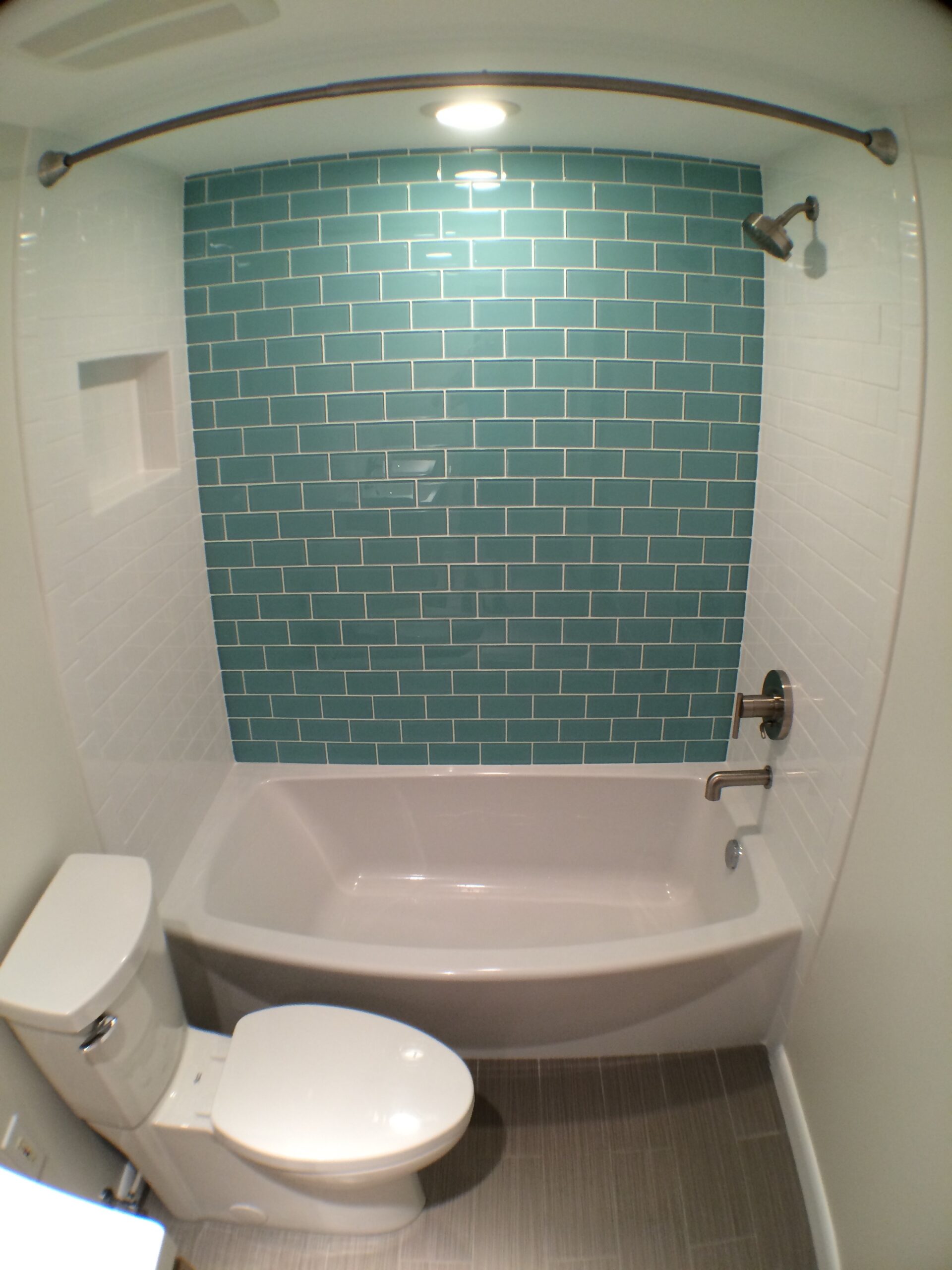 Full Tampa bathroom remodel with custom shower tile, new tub, and vanity