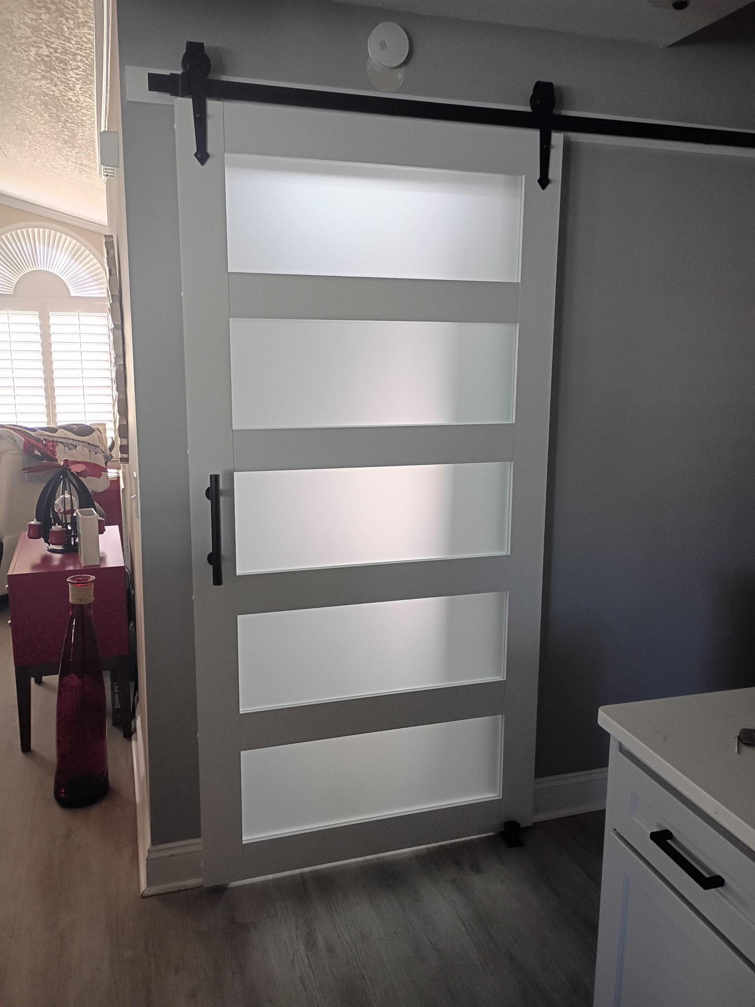 Custom barn door conversion with hardwood frame and sliding hardware by Jack O' Trades in Tampa, FL
